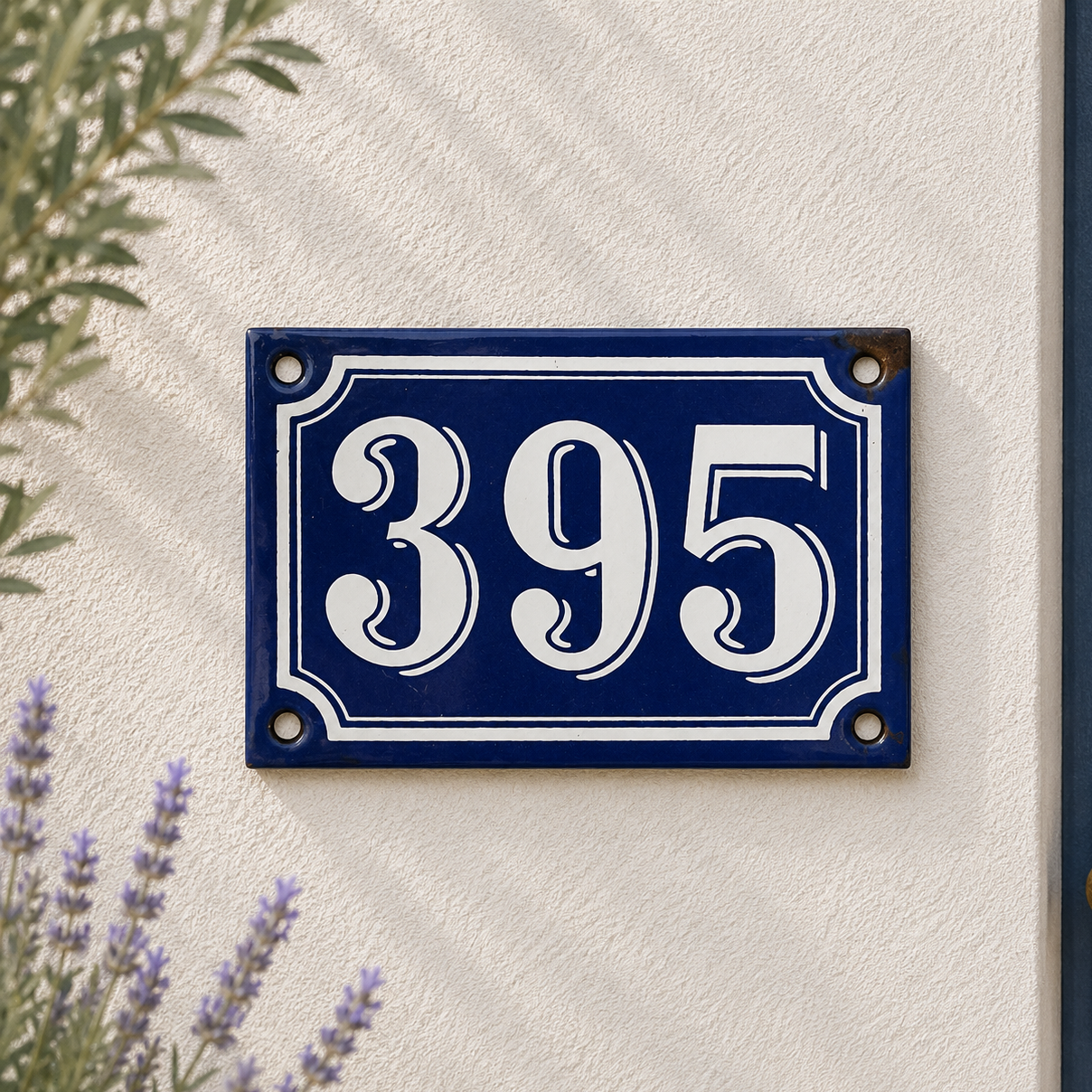 Blue and white house number sign with '395' on a light beige wall.