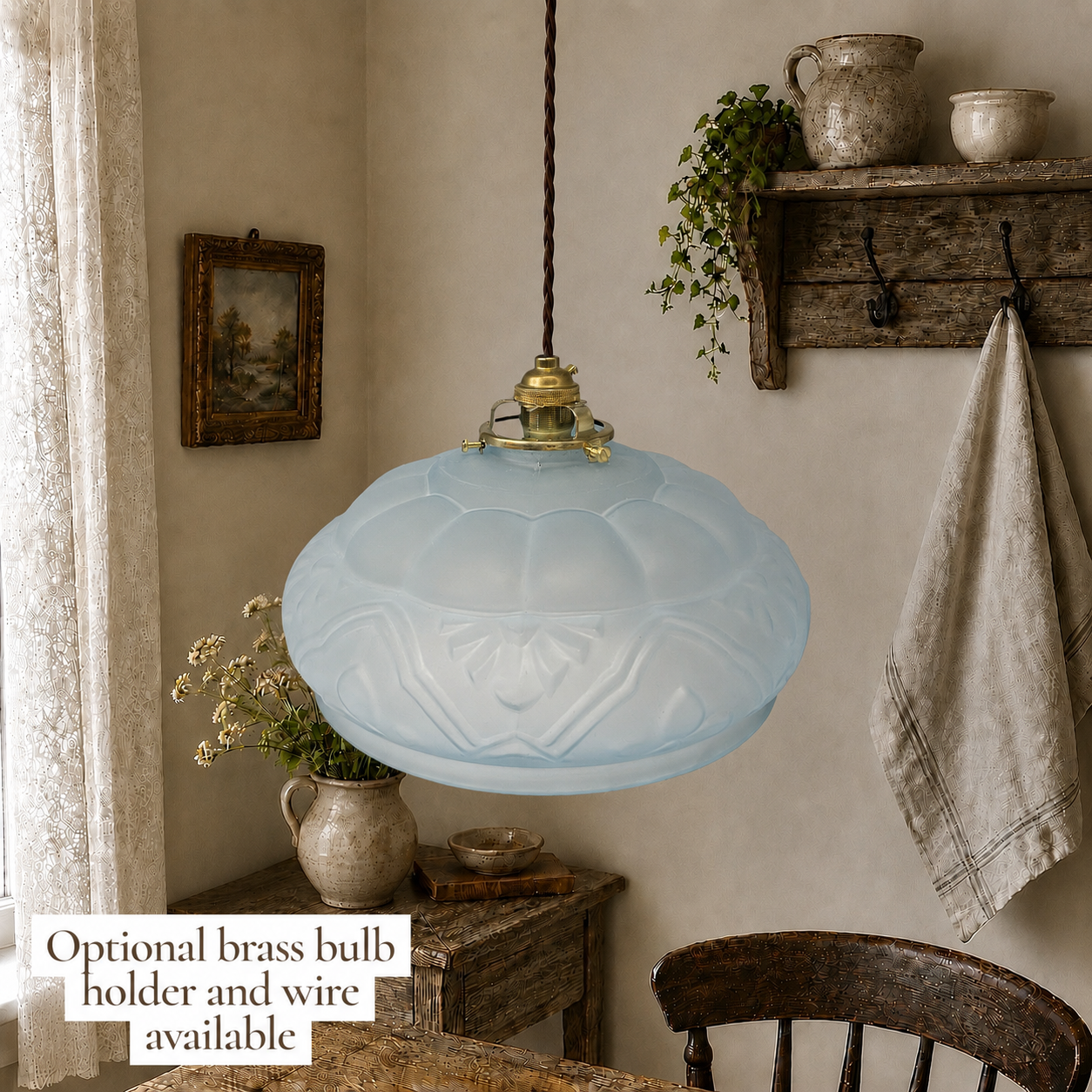 Vintage French frosted pale blue glass pendant light shade with original brass gallery styled in a rustic country kitchen setting.