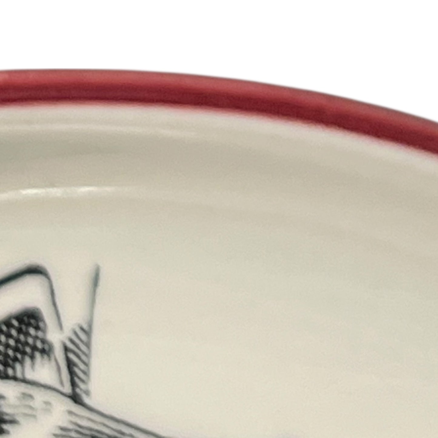 Close-up of a vintage fondue plate with detailed design on a white background