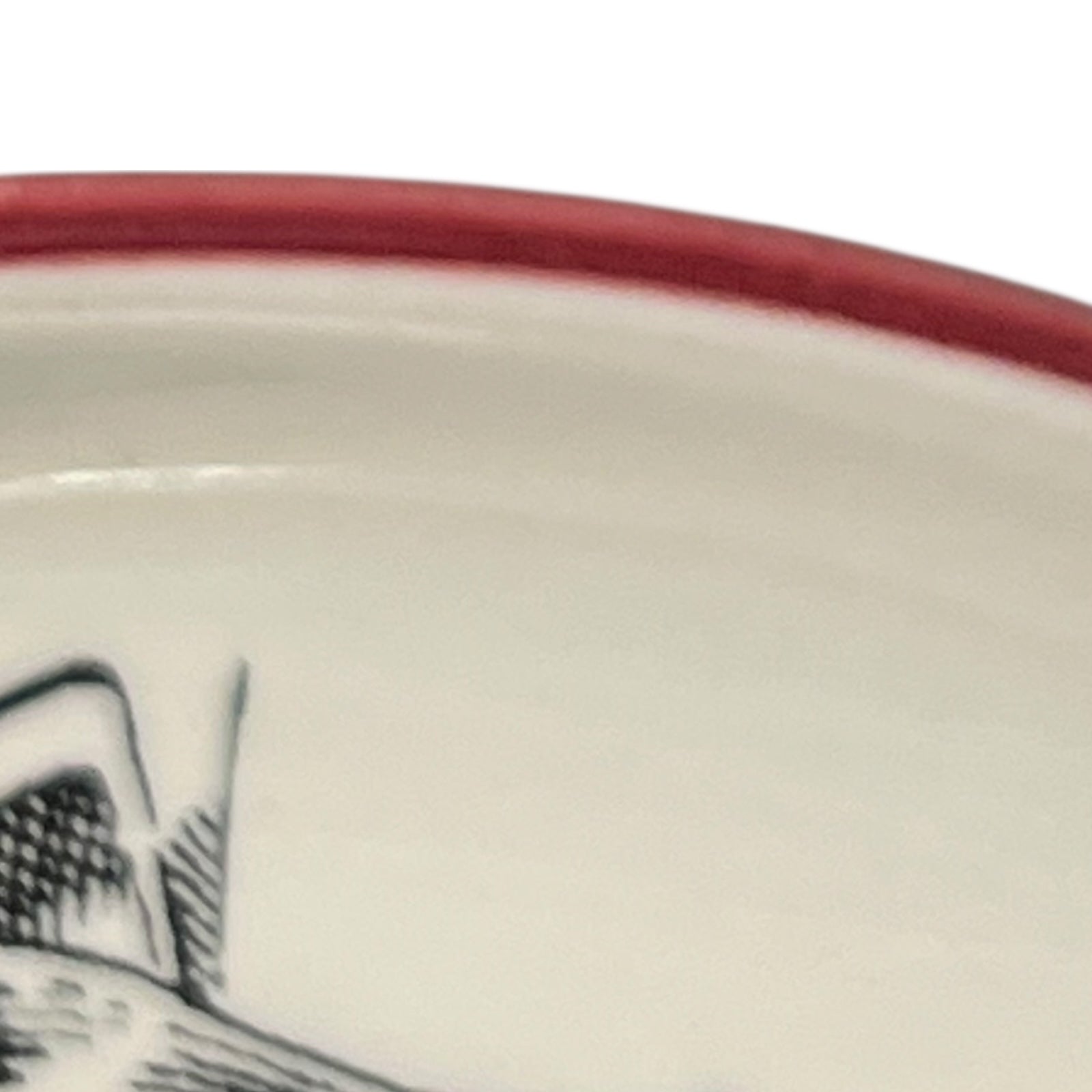 Close-up of a vintage fondue plate with detailed design on a white background