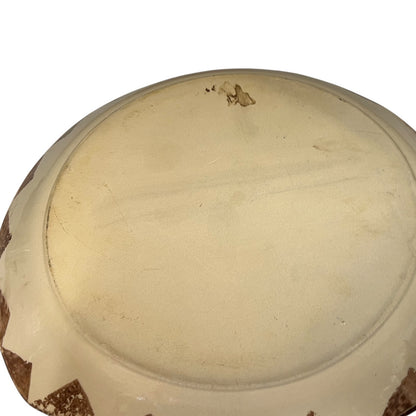 Reverse of a French dinner plate on a white background
