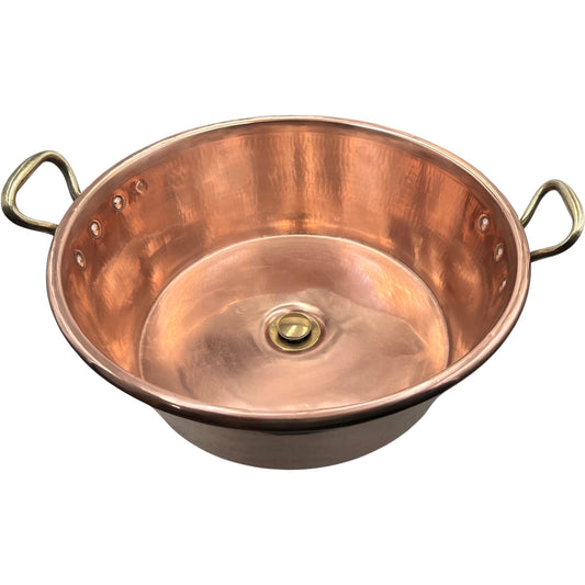 Copper sink with handles on a white background