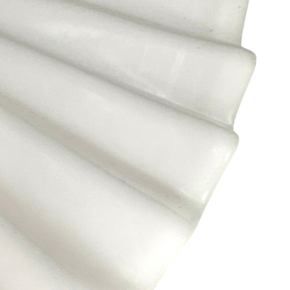 Close up of French glass lampshade on a white background