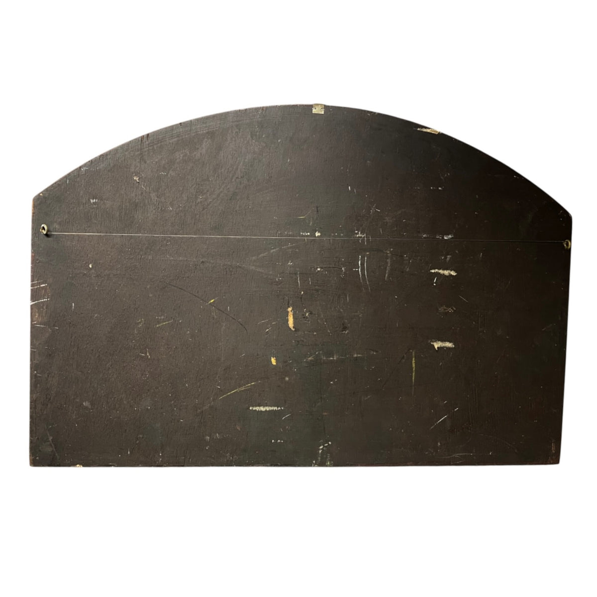 A dark brown wooden board with an arched top, showing signs of wear, scratches, and peeling paint, isolated on a white background.