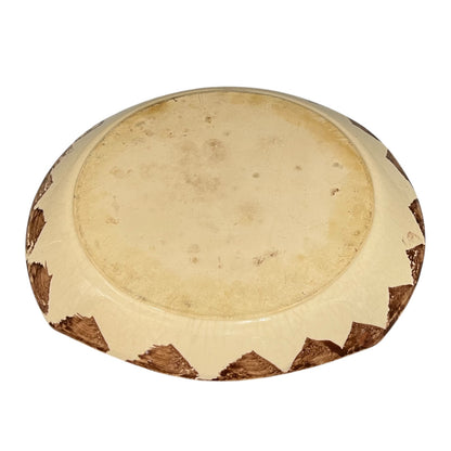 Reverse of a French dinner plate on a white background