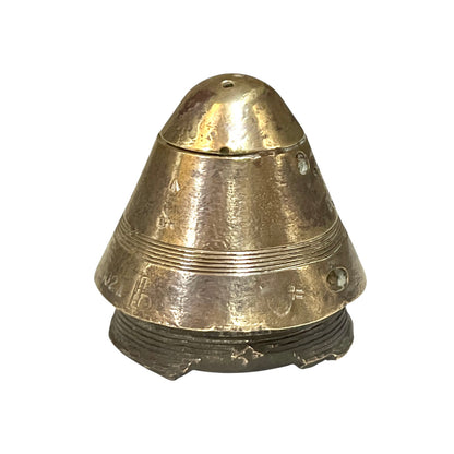 WW1 brass fuse paperweight on a white background