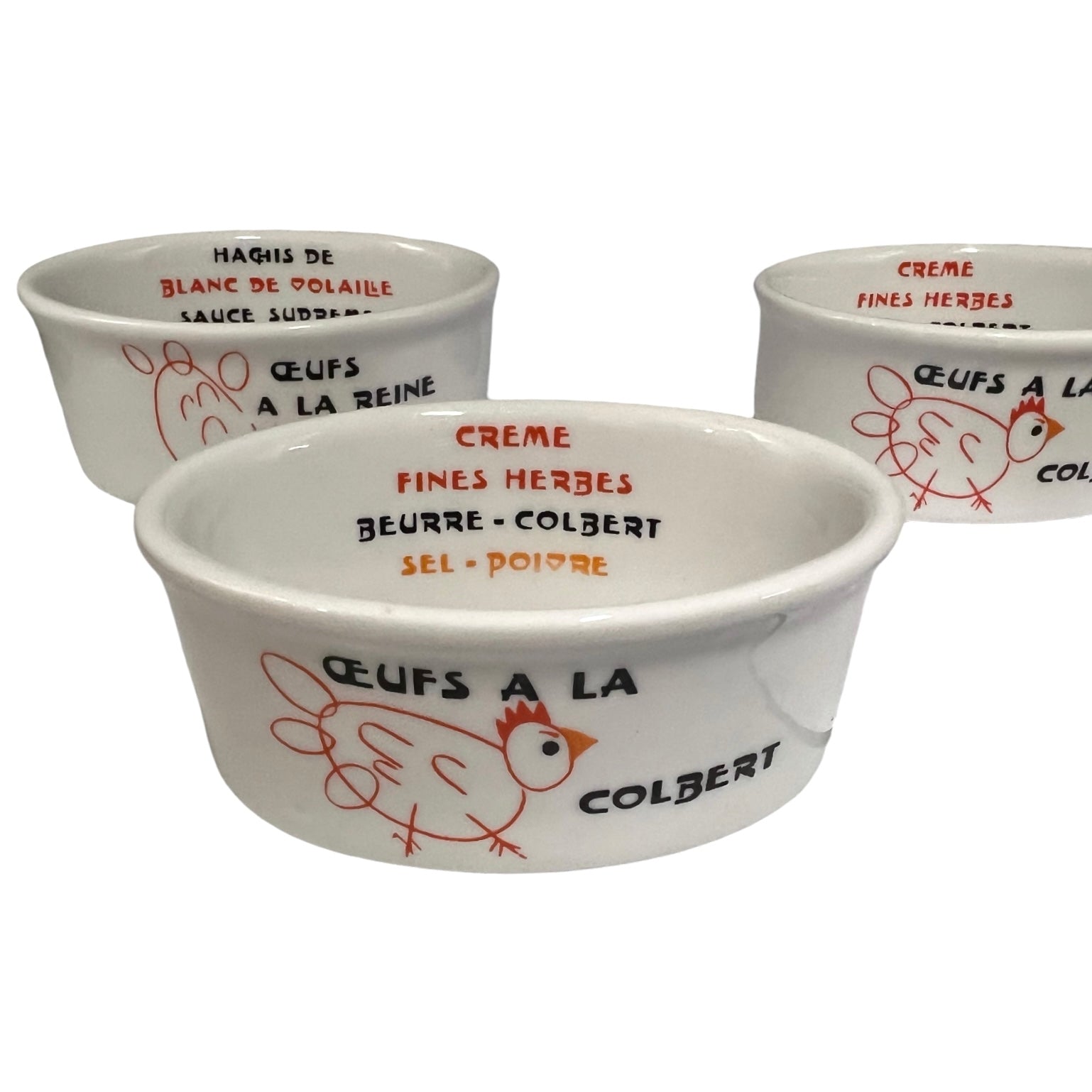 Three white ramekins with red and black text and chicken illustrations on a white background