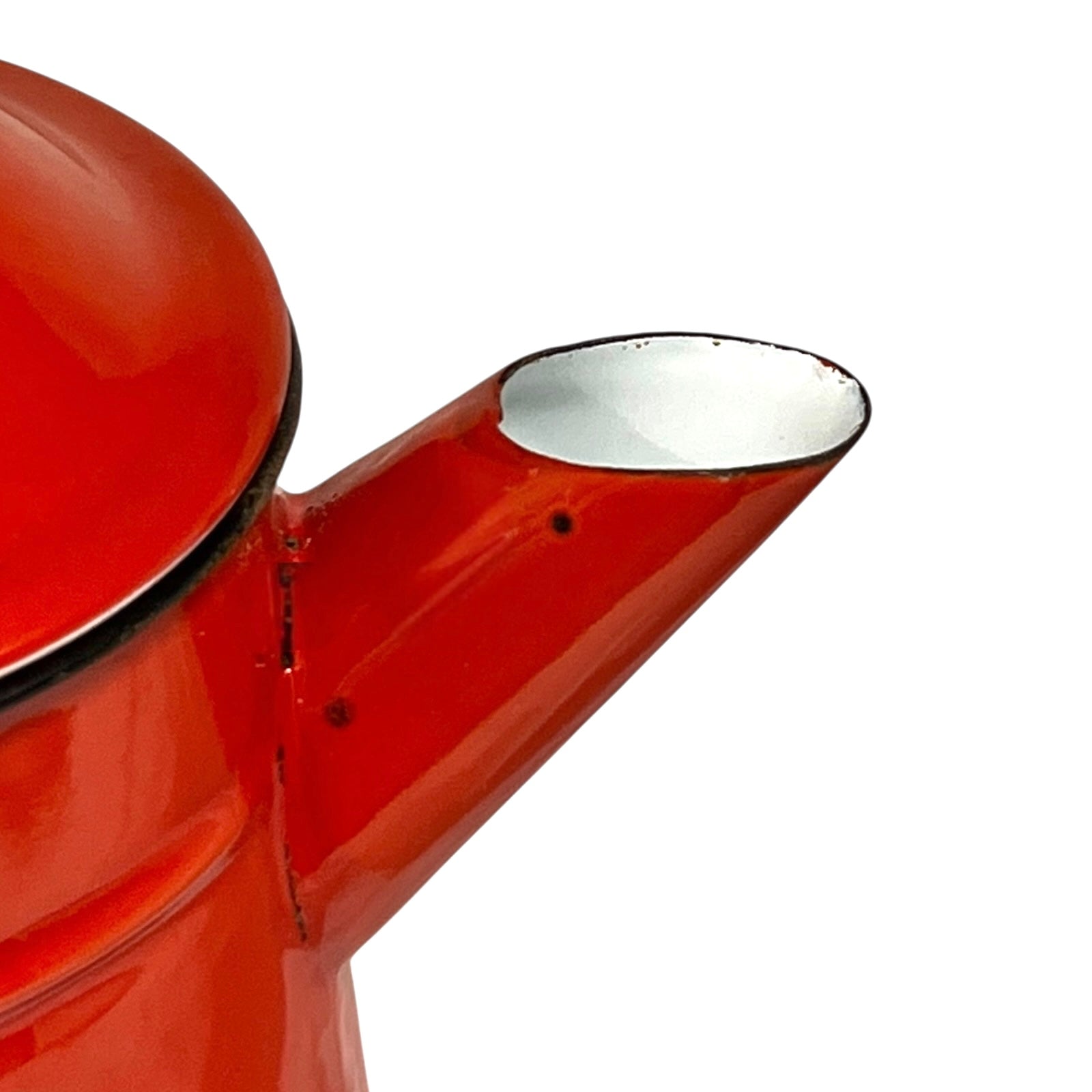 Close up of a red vintage French enamelled coffee pot on a white background