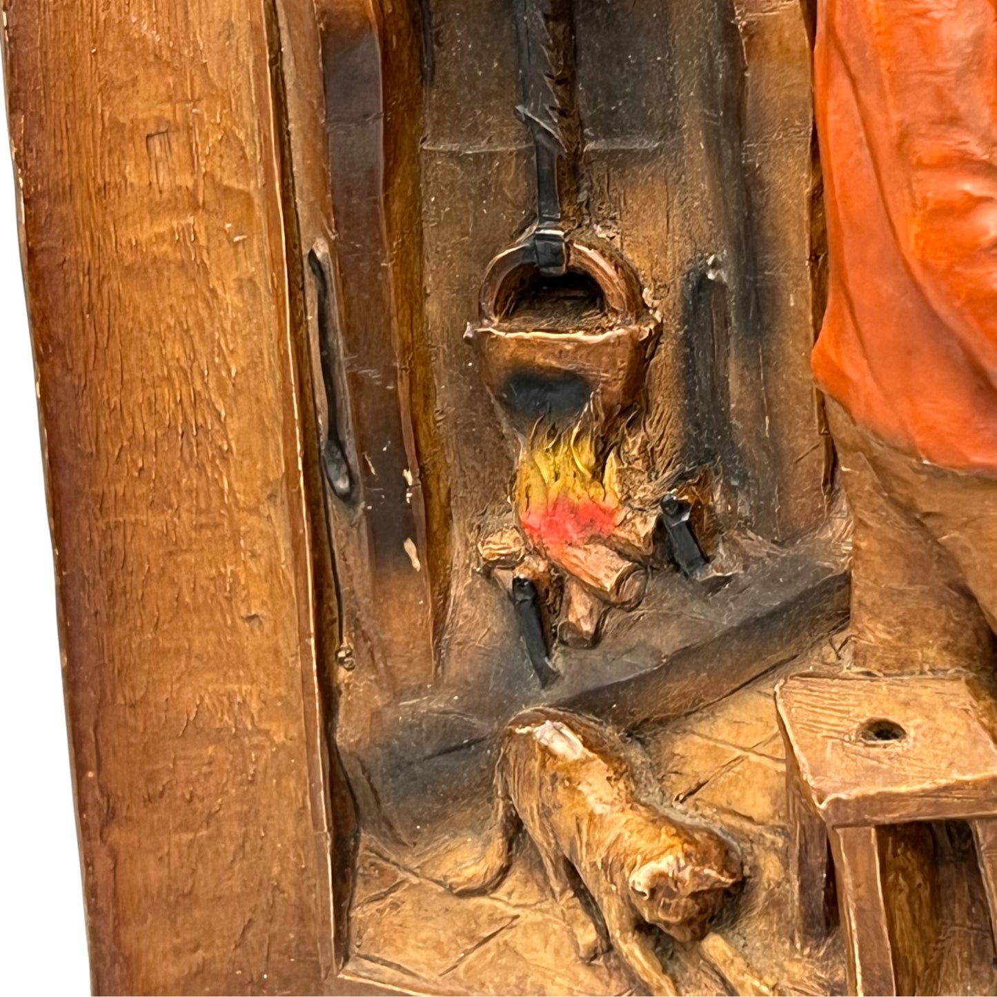 close up of wooden relief sculpture in an arts and crafts style on a white background