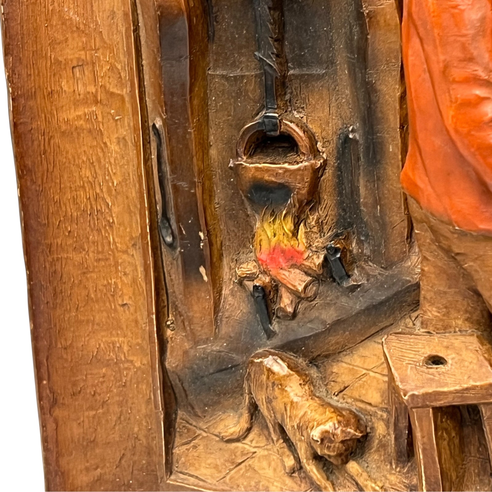 close up of wooden relief sculpture in an arts and crafts style on a white background