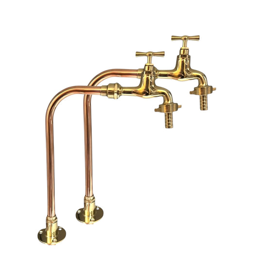 Pair of brass and copper kitchen faucets ideal for a farmhouse kitchen sink, camper van conversion or rustic bathroom on a white background