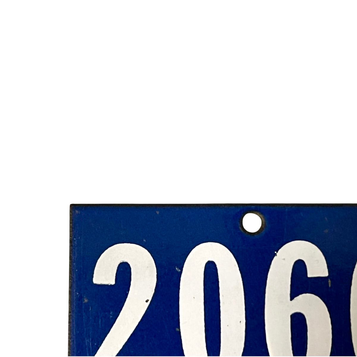 A close-up of a blue rectangular sign or plaque with large white numerals '206' and a small round hole near the top, shown against a white background.
