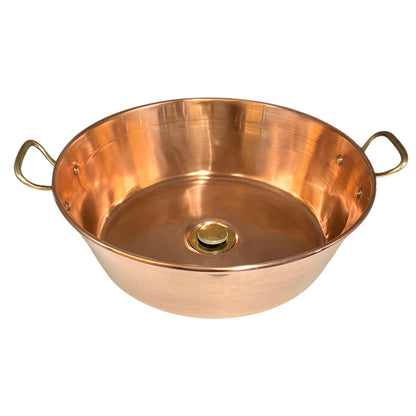 Copper up cycled sink basin with brass handles and a brass pop up waste, ideal for a rustic bathroom or camper van, set on a white background