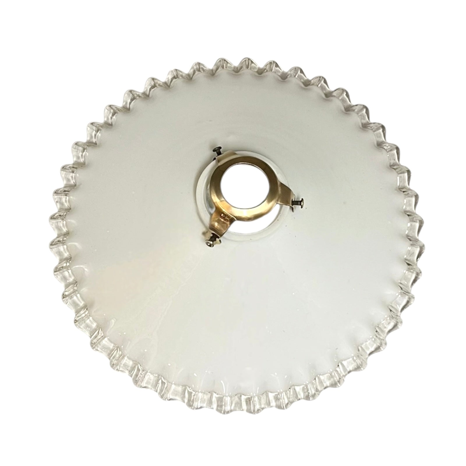 French vintage milk glass opaline lampshade with a clear trimmed frilly edge and a brass bulb holder ideal for a French country style set on a white background