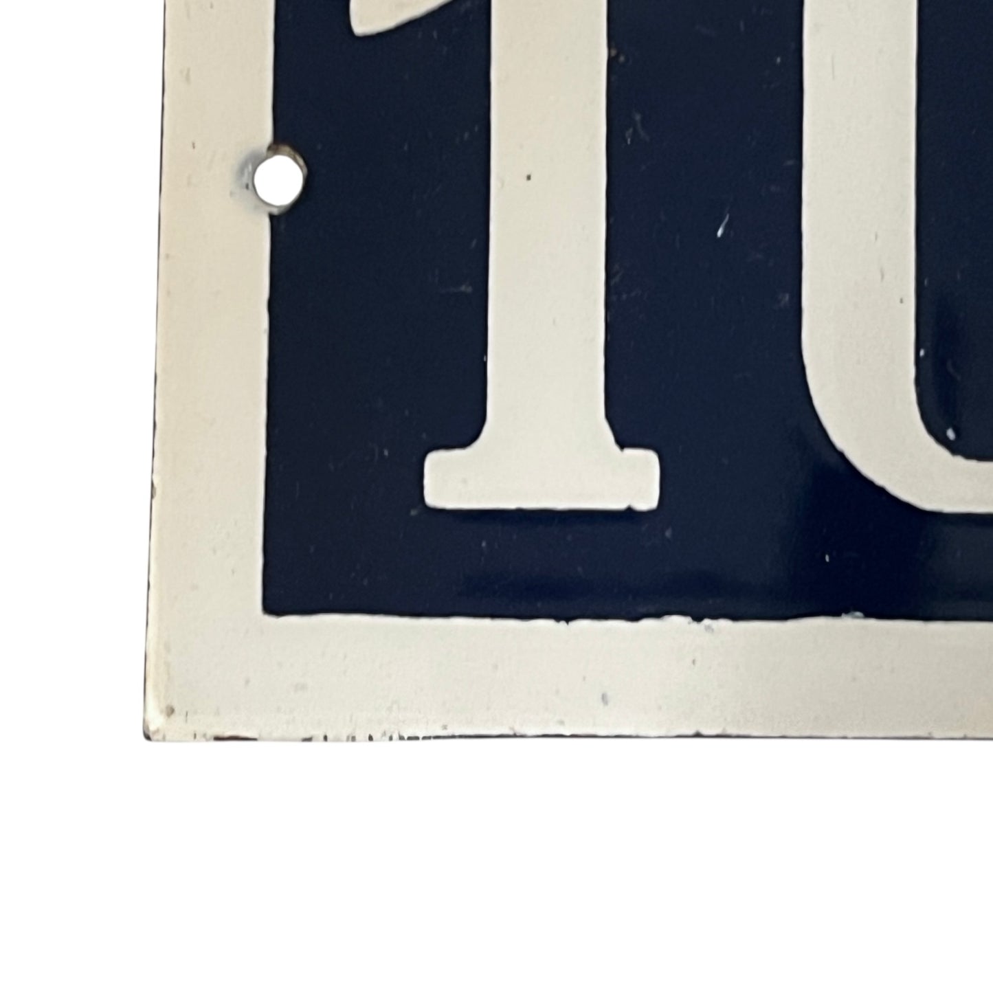 Close-up of a black and white number '10' on a white background