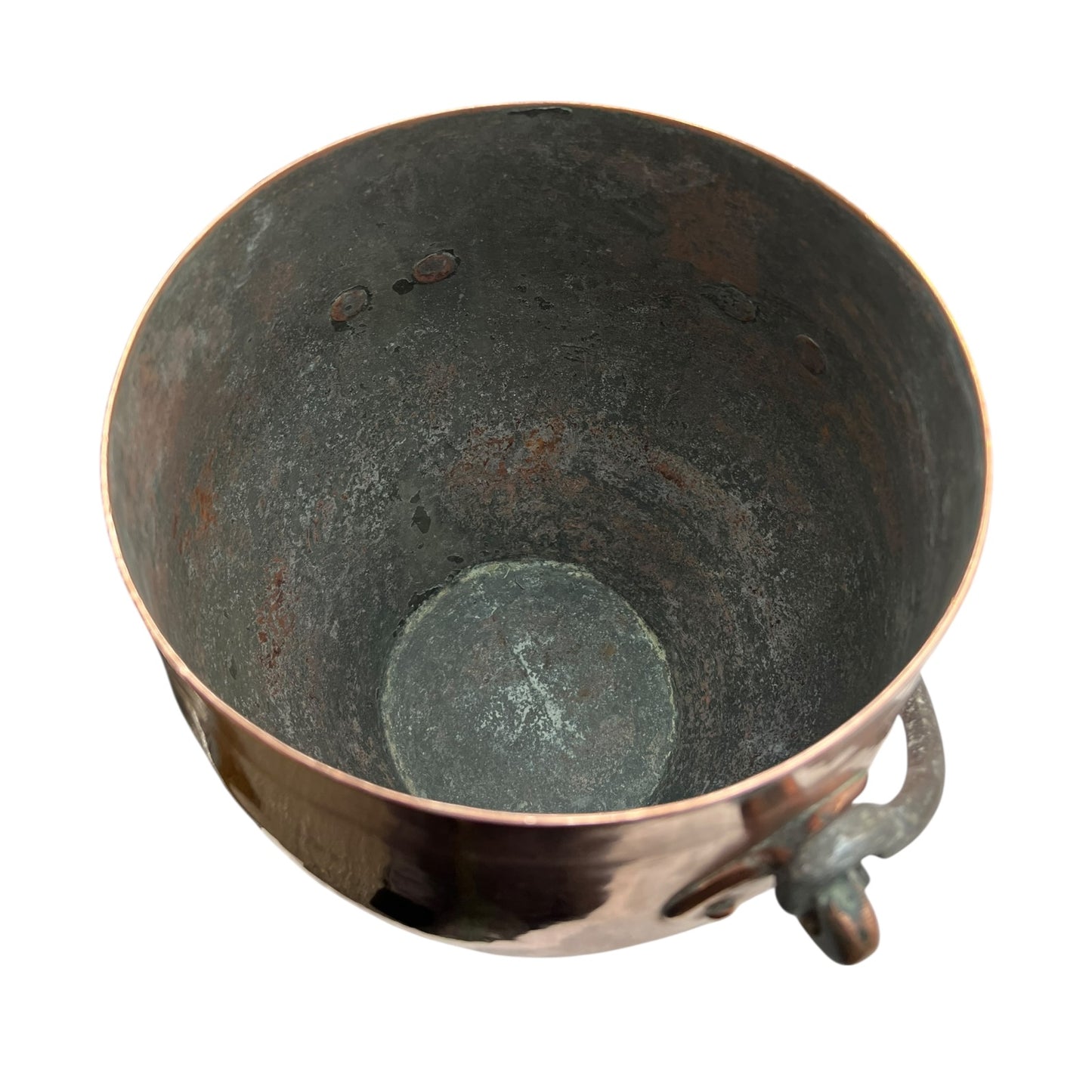 Inside of a copper cooking pot stockpot with handles on a white background