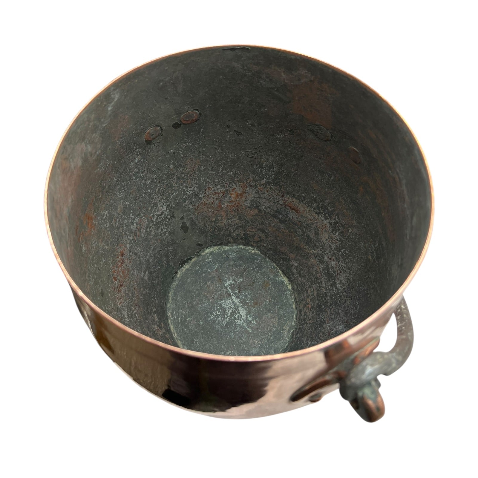Inside of a copper cooking pot stockpot with handles on a white background