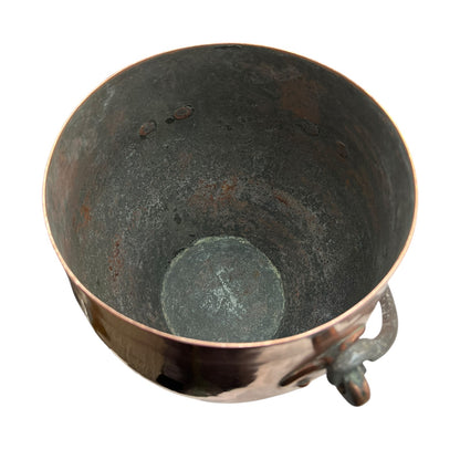 Inside of a copper cooking pot stockpot with handles on a white background