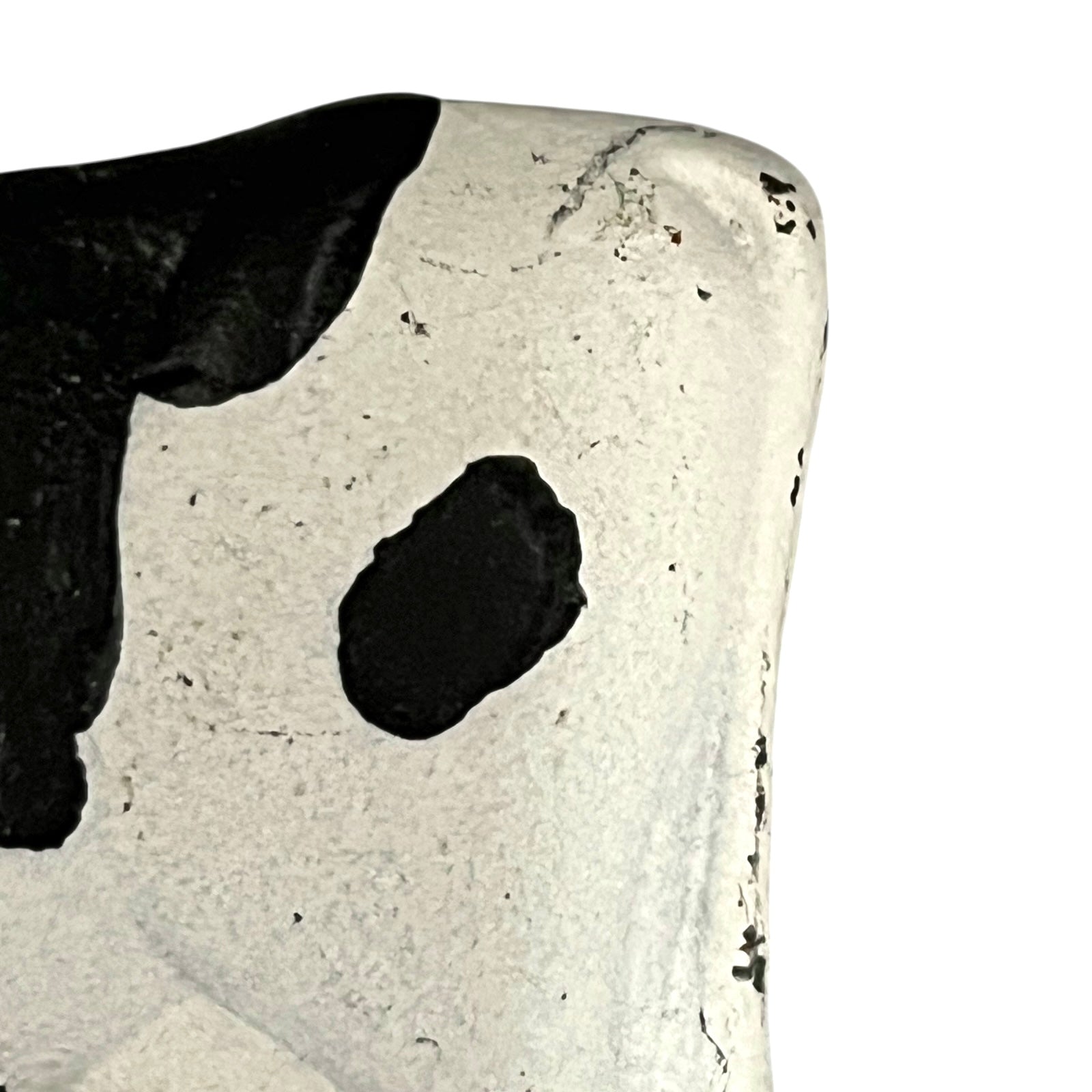 Close-up of a cow-shaped toiler paper roll holder  on a white background