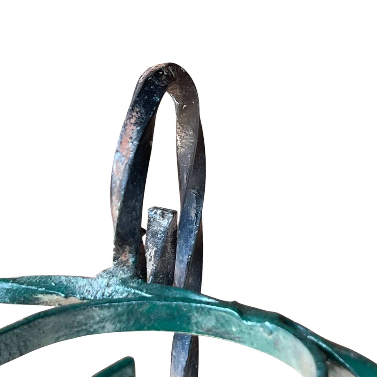 Close up of a wrought iron vintage plant stand on a white background 