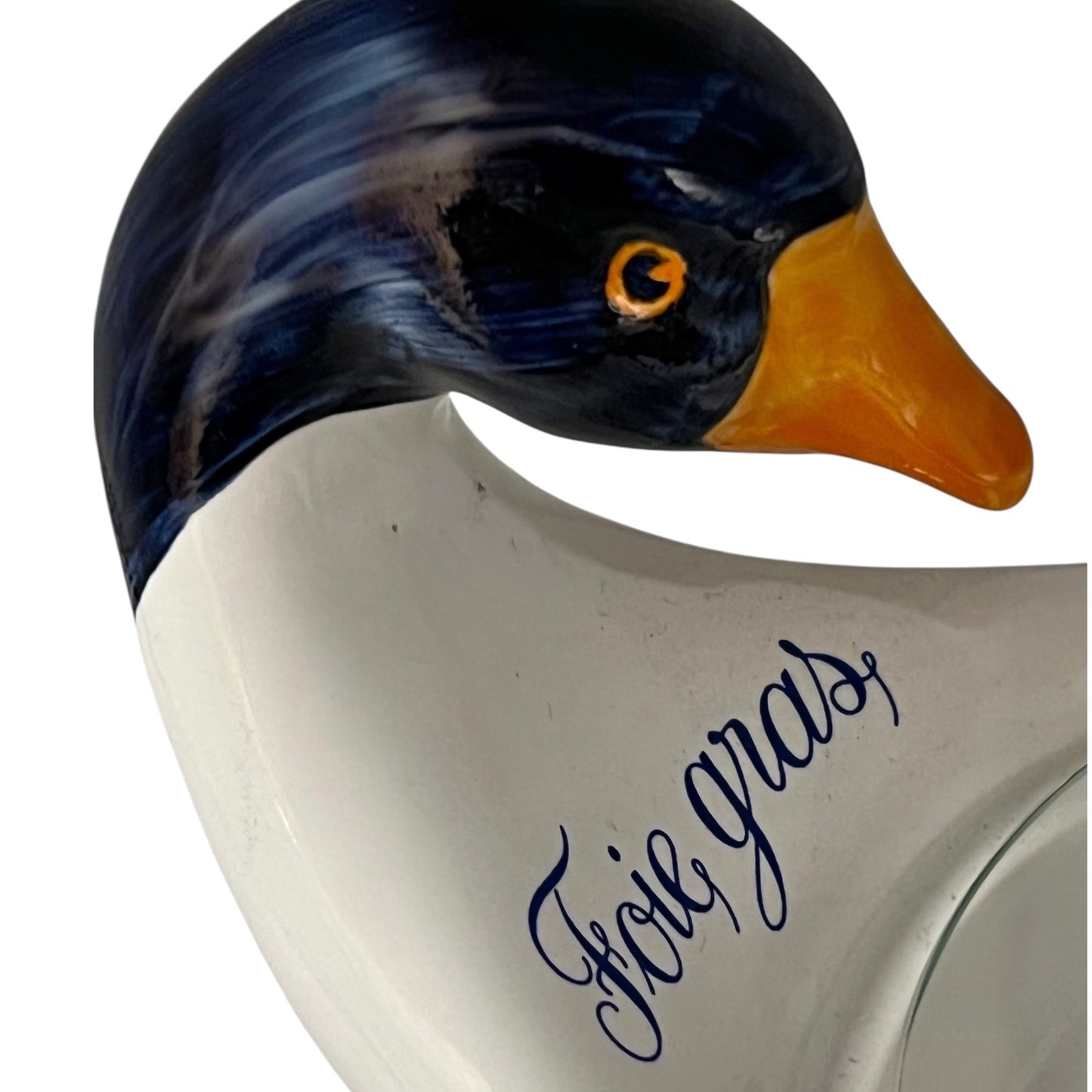 Ceramic dish shaped like a duck with Foie Gras' text on a white background