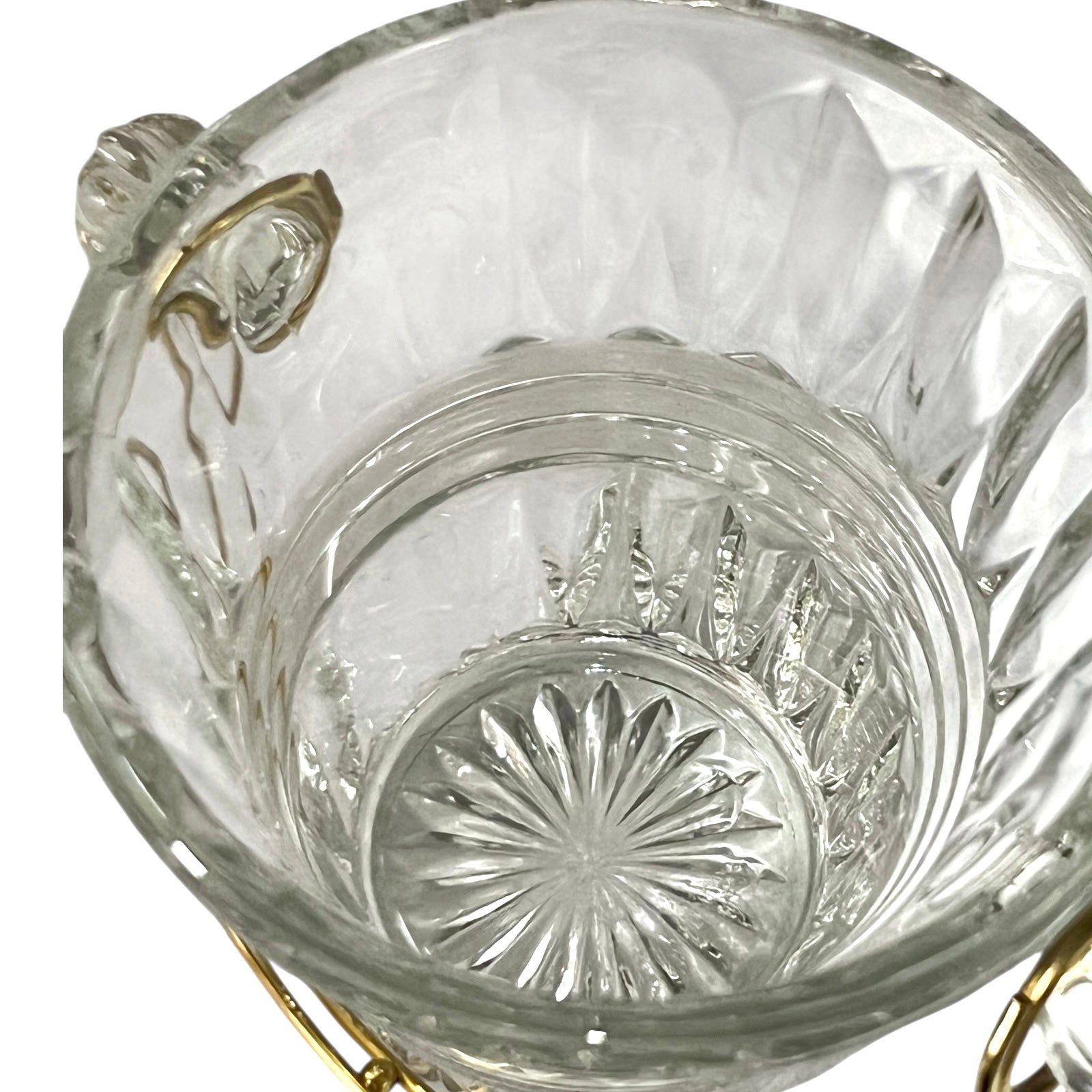 Clear glass candy dish with gold accents on a white background