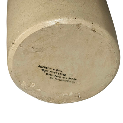 close up of a ww1 SRD jar base with a makers stamp on a white background 
