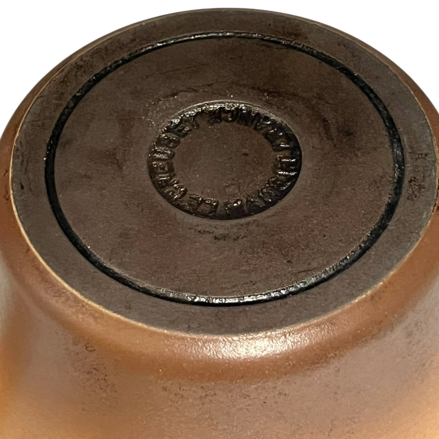 Close up of Le Creuset pan on a white background