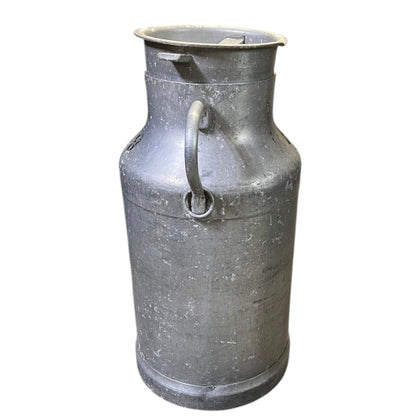 Metal milk churn on a white background