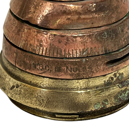 WW1 brass fuse paperweight on a white background