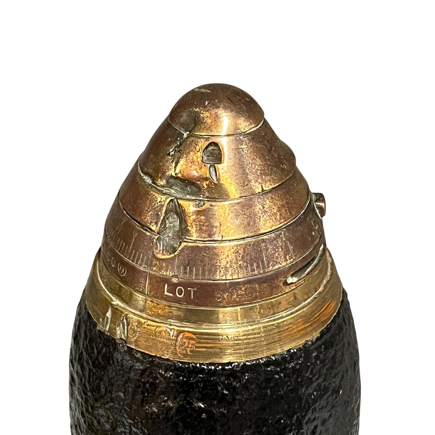 Close up of a British WW1 brass fuse on a black shrapnel shell st on a white background 
