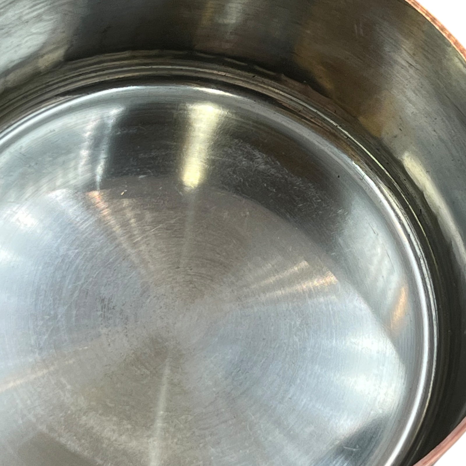 close up of copper pan tin lining