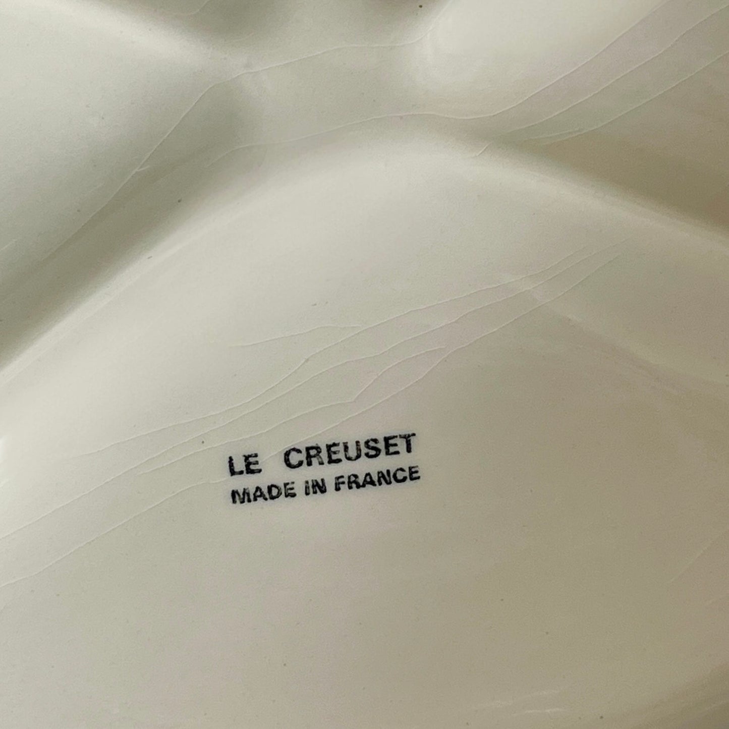 Le Creuset logo on a ceramic dish
