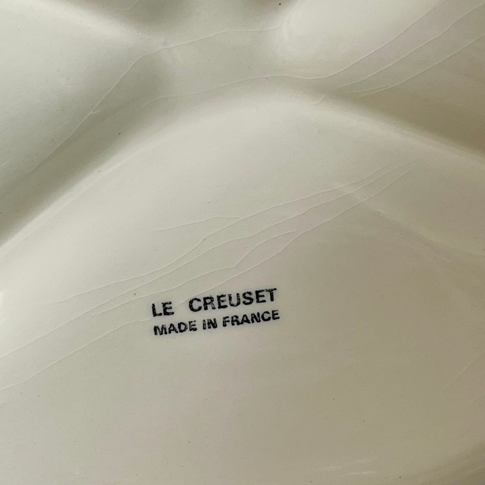Le Creuset logo on a ceramic dish