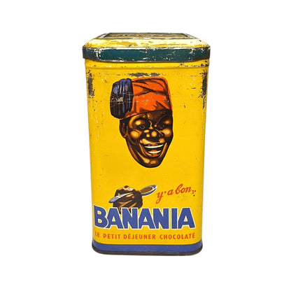 Vintage tin can with a colorful design featuring a face and 'Banania' branding on a white background.