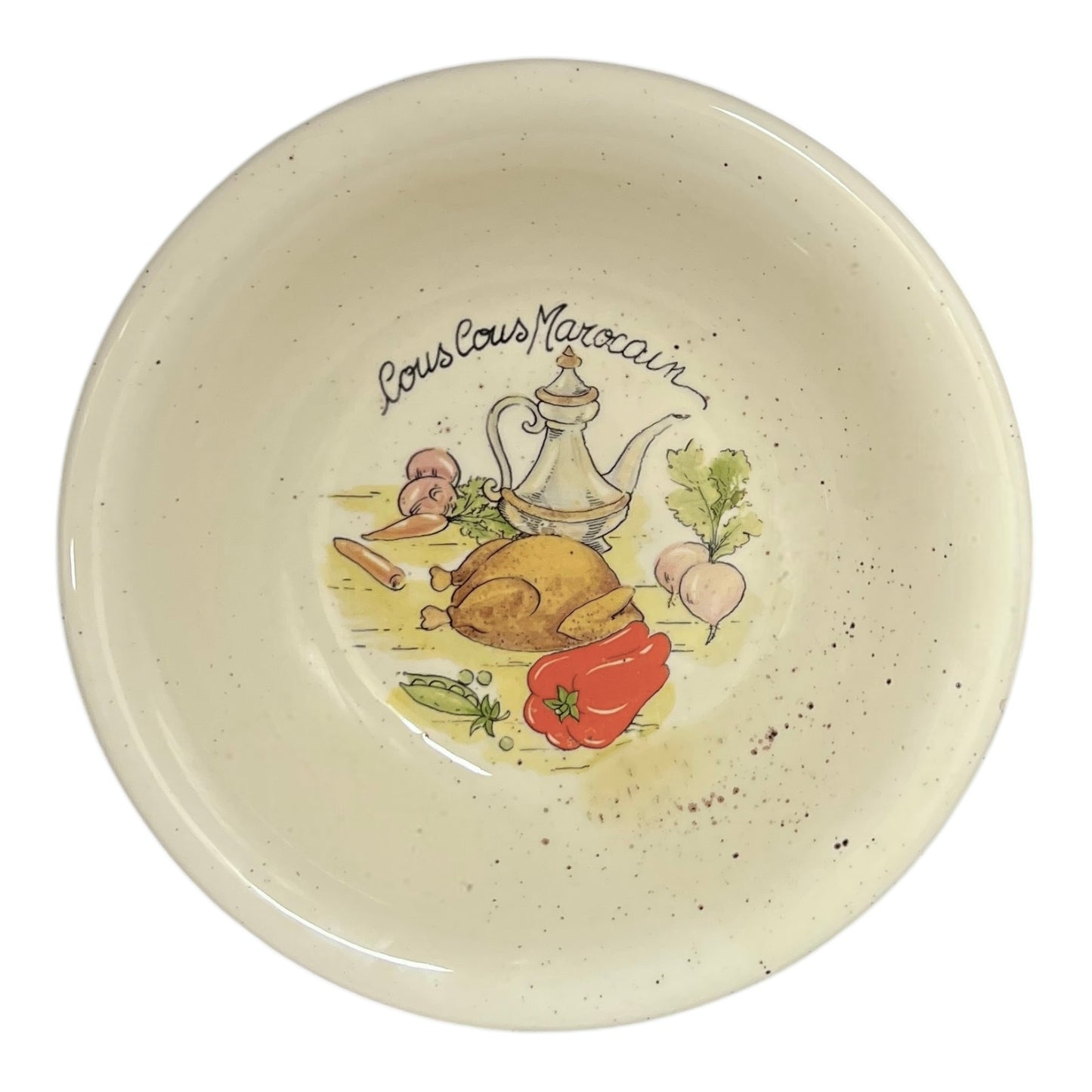 Ceramic bowl with 'Couscous Marocain' design on a white background