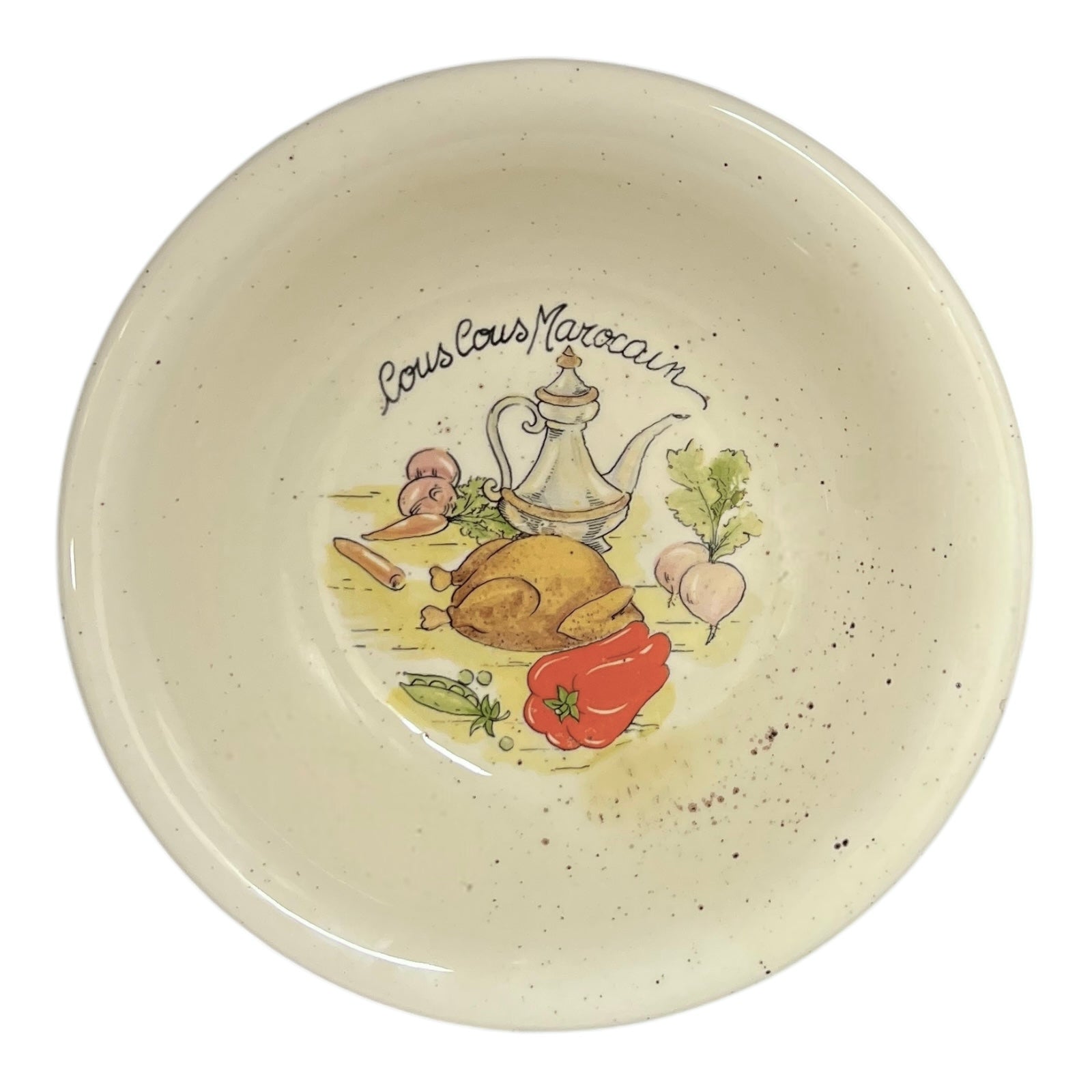 Ceramic bowl with 'Couscous Marocain' design on a white background