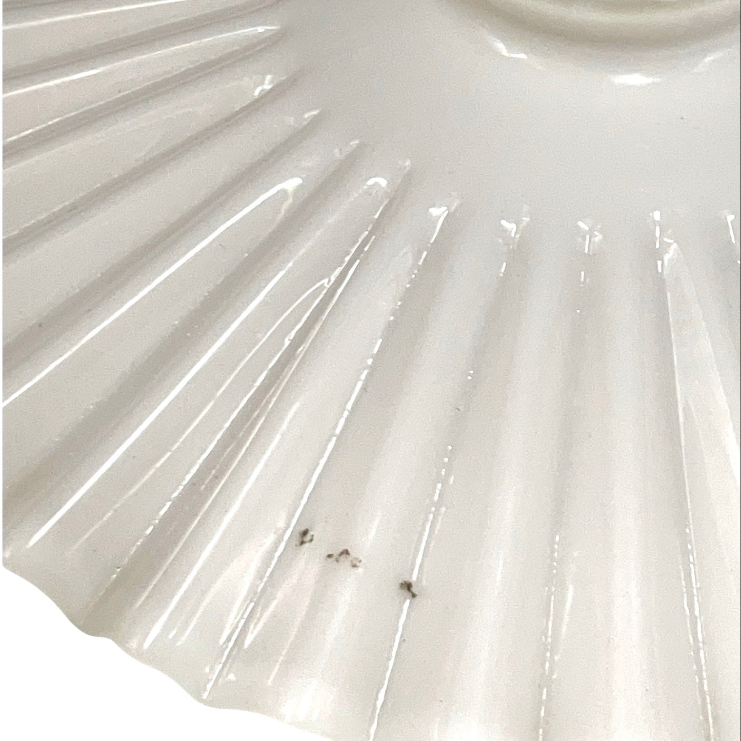 Close up of French glass lampshade on a white background