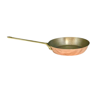 French Copper frying pan with a brass handle on a white background