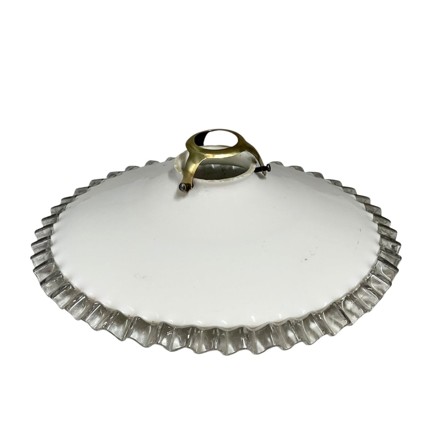 White round vintage glass lampshade with a frilled clear edge and a brass collar on a white background