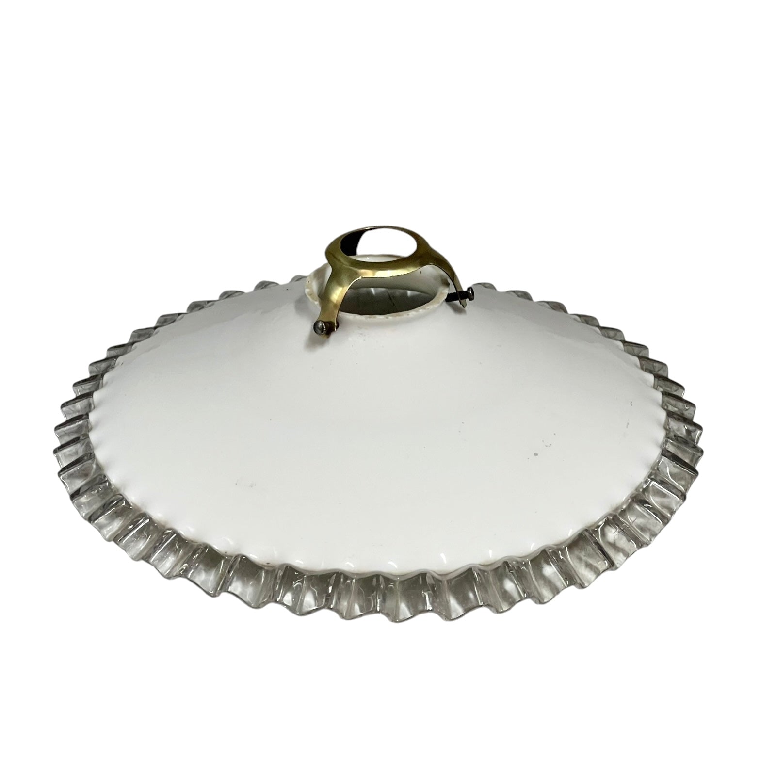 White round vintage glass lampshade with a frilled clear edge and a brass collar on a white background