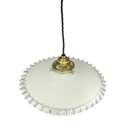 Vintage-style pendant light with white glass shade and brass fitting on a white background