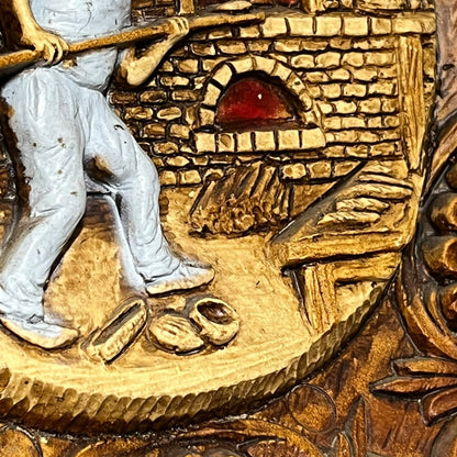 Close up of a raised 3d wood resin wall plaque of a French baker on a white background