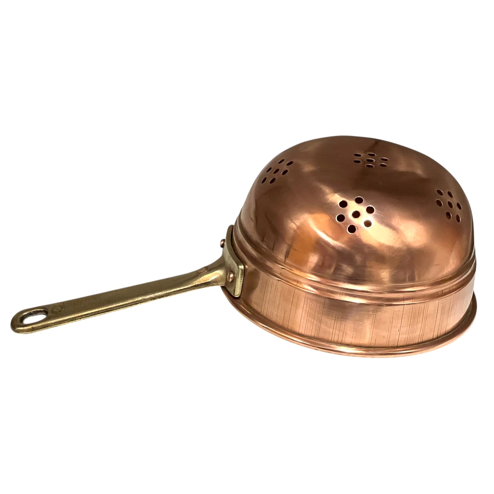 Small copper French sieve with a brass handle on a white background