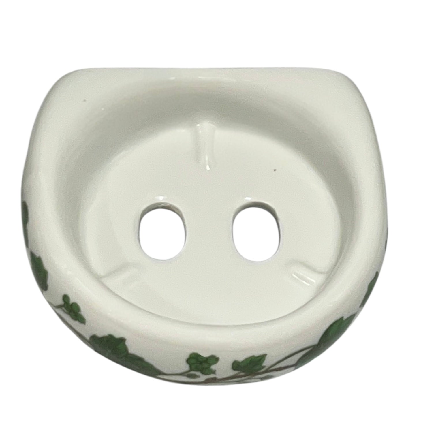 Porcelain bathroom toothbrush holder  featuring green leaf patterns on a white background