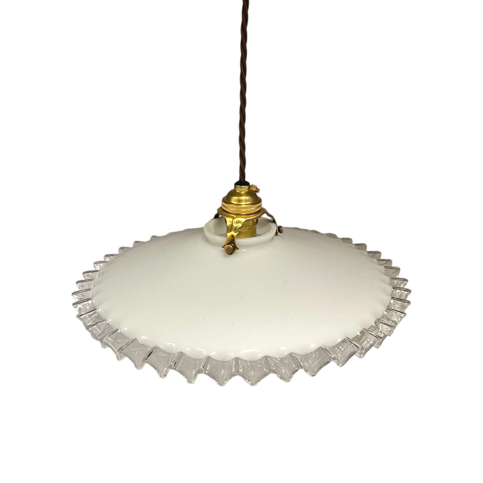 Vintage-style pendant light with white glass shade and brass fitting on a white background