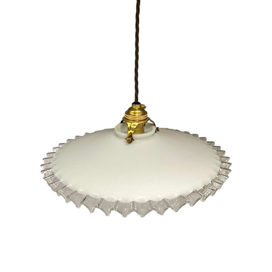 Vintage-style pendant light with white glass shade and brass fitting on a white background