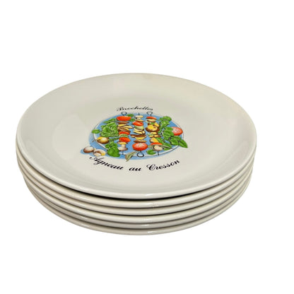 Set of five ceramic plates with a central design and text on a white background