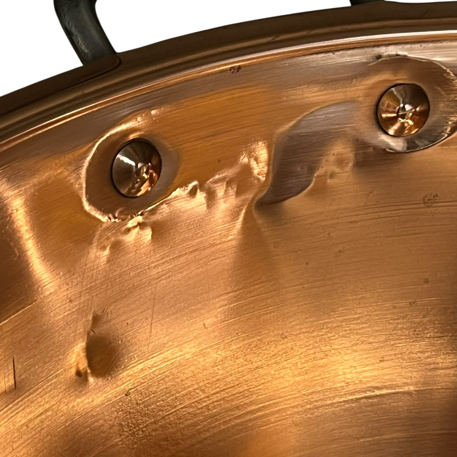 Close up of a French copper bathroom basin on a white background