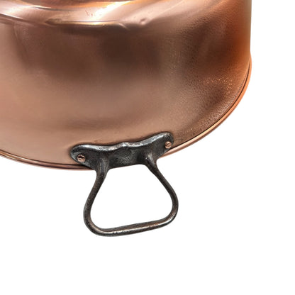 Close up of a copper sink on a white background 